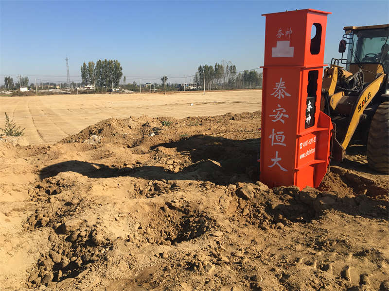 Installation of rapid impact compactor on loader for construction