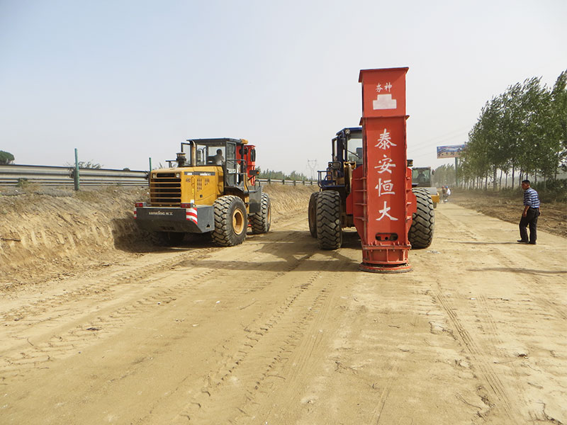 Two rapid impact compactors are installed on the loader for construction